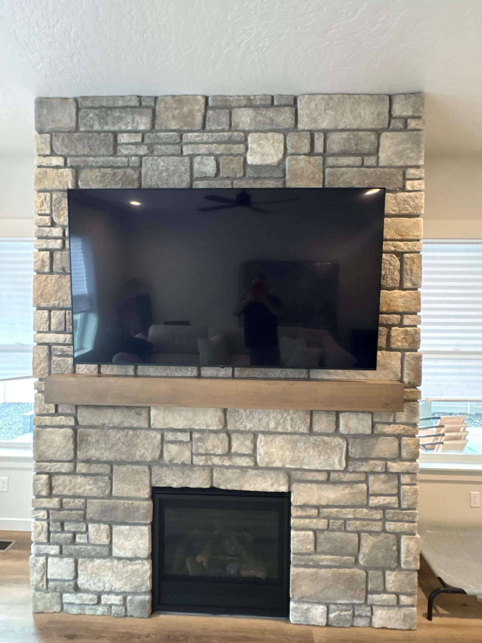 Expert 56"+ TV Mounting on Stone Wall in Boise, Idaho - Image 1