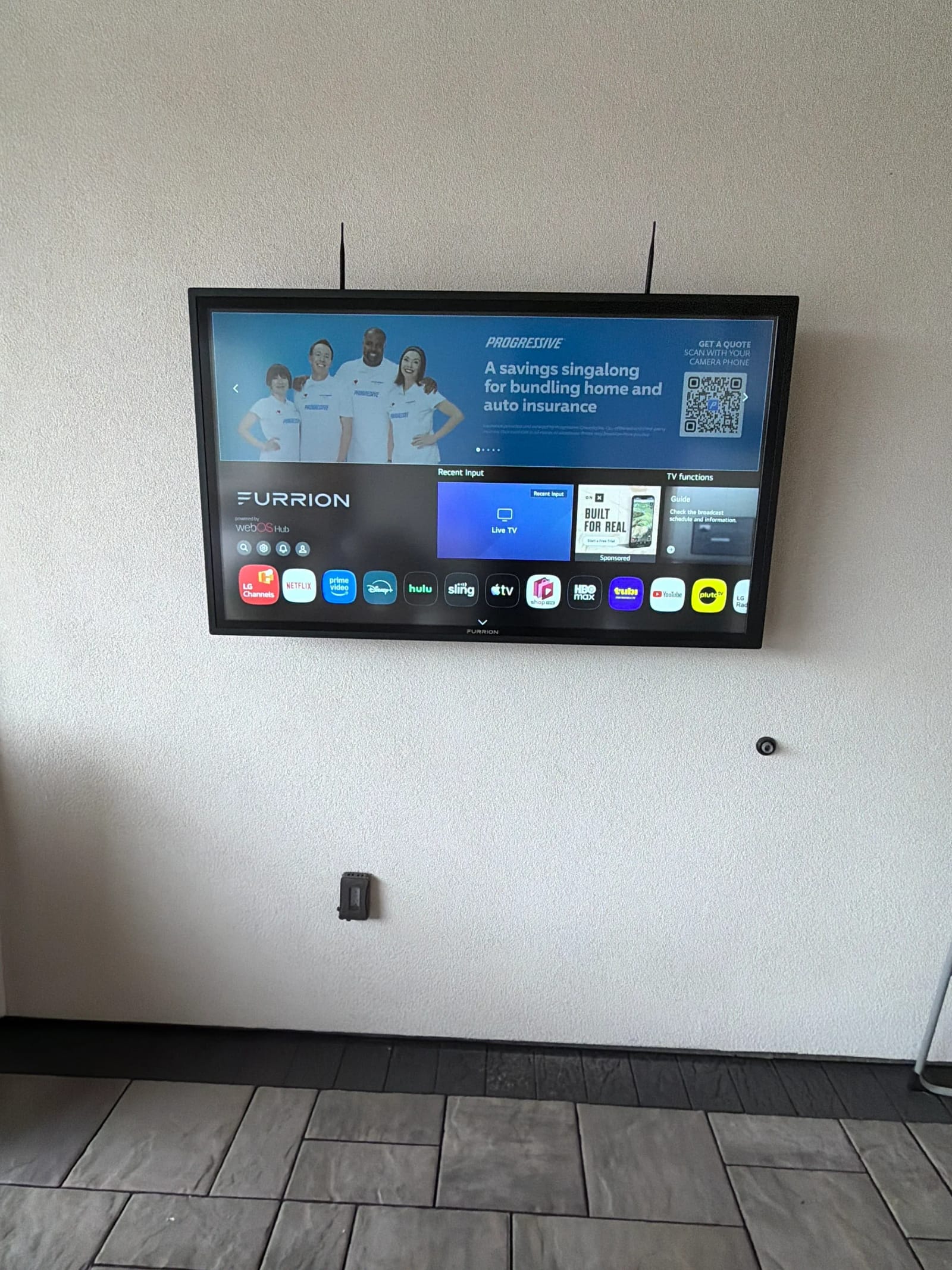 Furrion outdoor TV on stucco wall