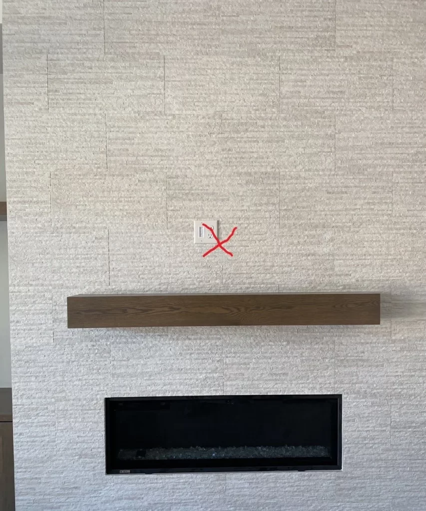 Incorrectly places outlets above a fireplace