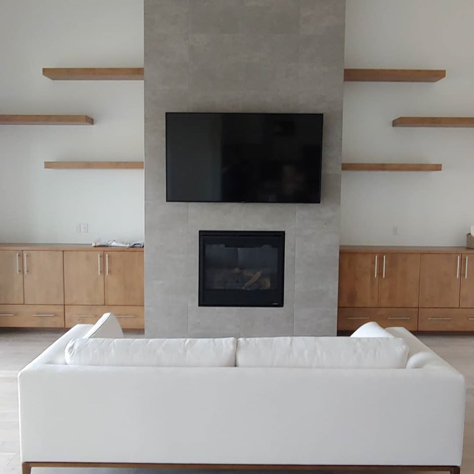Frame TV Mounted above fireplace